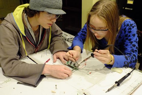 Derrick and Haley replace a resistor in the bidirectional motor controller .