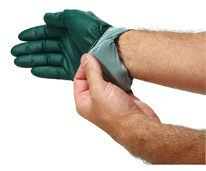 professional putting on safety gloves